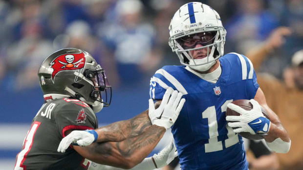 Tampa Bay Buccaneers safety Antoine Winfield Jr. (31) works to push Indianapolis Colts wide receiver Michael Pittman Jr. (11) out of bounds Sunday, Nov. 26, 2023, during a game against the Tampa Bay Buccaneers at Lucas Oil Stadium in Indianapolis.  